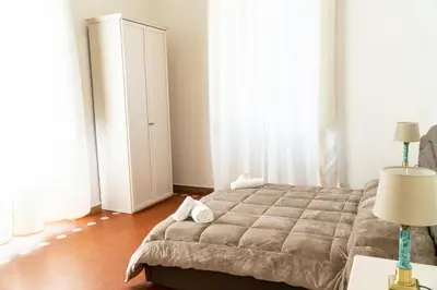 Letto o letti in una camera di Residence Le Cure