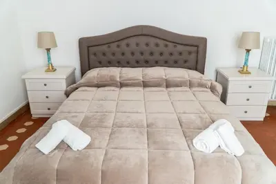 Letto o letti in una camera di Residence Le Cure