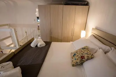 Letto o letti in una camera di Acacia Firenze - Calla