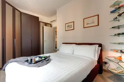 Letto o letti in una camera di Binario9 Terrace Apartment by Mamo Florence