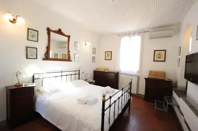Letto o letti in una camera di Acacia Firenze - Cosmea