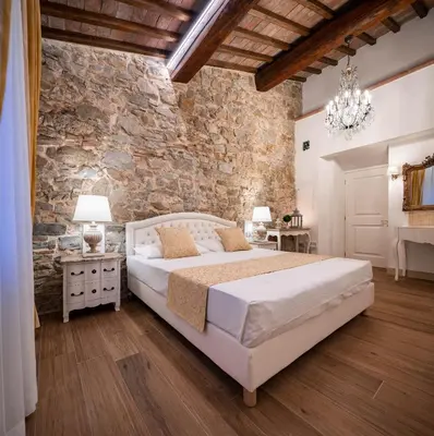 Letto o letti in una camera di Agri Resort & SPA Le Colline del Paradiso