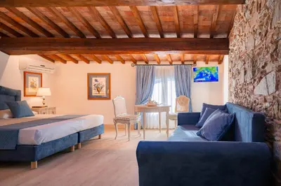 Letto o letti in una camera di Agri Resort & SPA Le Colline del Paradiso