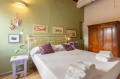 Letto o letti in una camera di Una finestra sulle Cappelle Medicee by Mmega