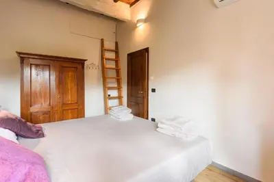 Letto o letti in una camera di Una finestra sulle Cappelle Medicee by Mmega
