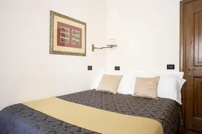 Letto o letti in una camera di B&B Le Cannelle FIESOLE
