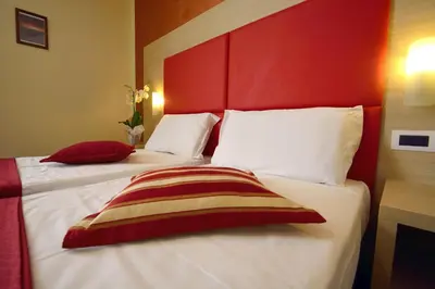 Letto o letti in una camera di B&B Marbò Florence
