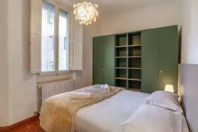 Letto o letti in una camera di Palazzo Gherardi Apartments
