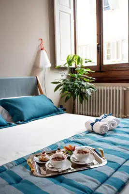 Letto o letti in una camera di Palazzo Gherardi Apartments