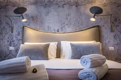Letto o letti in una camera di Palazzo dei Conti Residenza d'Epoca