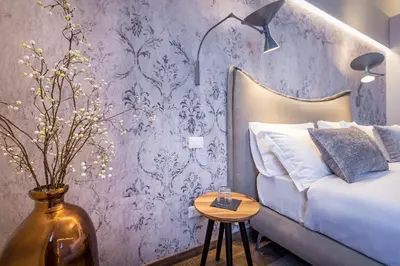 Letto o letti in una camera di Palazzo dei Conti Residenza d'Epoca