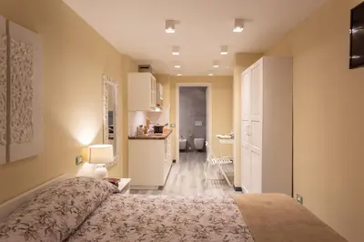 Letto o letti in una camera di GuestHost - Le stanze di Carla! Con cucina e bagno privato