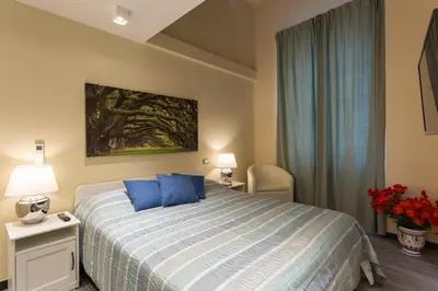 Letto o letti in una camera di GuestHost - Le stanze di Carla! Bagno privato, cucina in comune