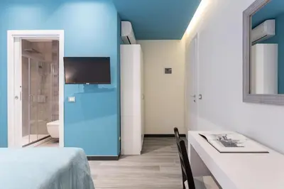 Letto o letti in una camera di GuestHost - Le stanze di Carla! Bagno privato, cucina in comune