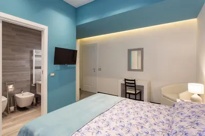 Letto o letti in una camera di GuestHost - Le stanze di Carla! Bagno privato, cucina in comune
