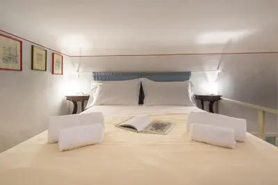 Letto o letti in una camera di Vellutini by Mmega