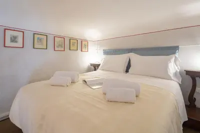Letto o letti in una camera di Vellutini by Mmega