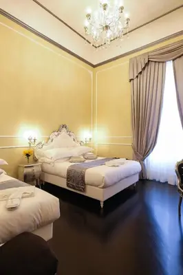 Letto o letti in una camera di B&B Kingsman