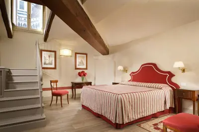 Letto o letti in una camera di Palazzo Niccolini al Duomo Residenza D'Epoca