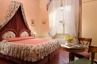 Letto o letti in una camera di Palazzo Niccolini al Duomo Residenza D'Epoca