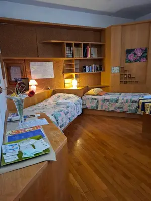 Letto o letti in una camera di B&B DUE ABETI