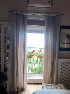 Letto o letti in una camera di Casa Belvedere Firenze