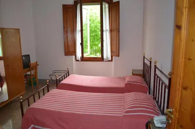 Letto o letti in una camera di Albergo Padellino