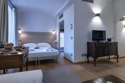 Letto o letti in una camera di TWO TOWERS-Ramaglianti & Belfredelli