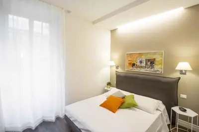 Letto o letti in una camera di Residenza de Boni Apartment with Duomo View