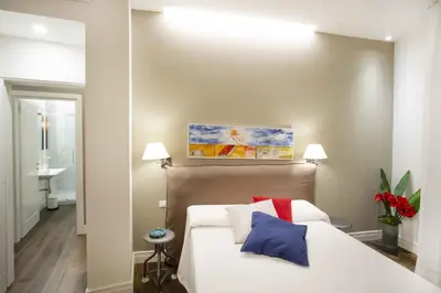 Letto o letti in una camera di Residenza de Boni Apartment with Duomo View