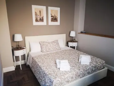 Letto o letti in una camera di lacasadicavour Duomo Apt