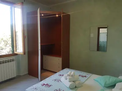 Letto o letti in una camera di Piccolo Poggio Apartments