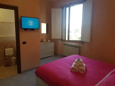 Letto o letti in una camera di Piccolo Poggio Apartments