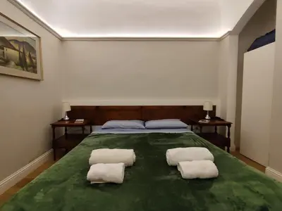 Letto o letti in una camera di BORGO SAN FREDIANO SUITES