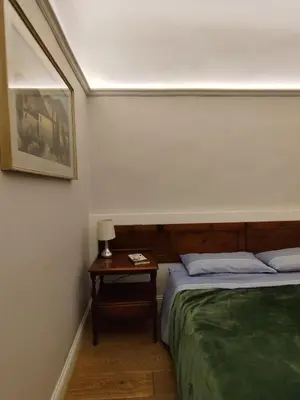 Letto o letti in una camera di BORGO SAN FREDIANO SUITES