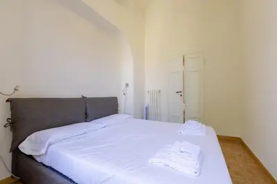 Letto o letti in una camera di Elegance in Santa Maria Novella