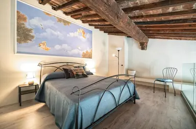 Letto o letti in una camera di Cavour Suite Mezzanine by 360Rentals