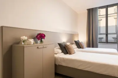 Letto o letti in una camera di Apartments Florence - Duomo Contemporary
