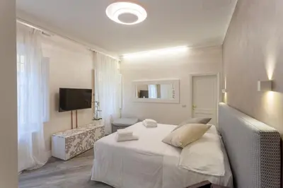 Letto o letti in una camera di DUOMO SUITE GHIRLANDAIO