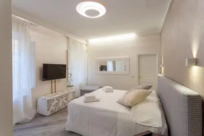 Letto o letti in una camera di DUOMO SUITE GHIRLANDAIO