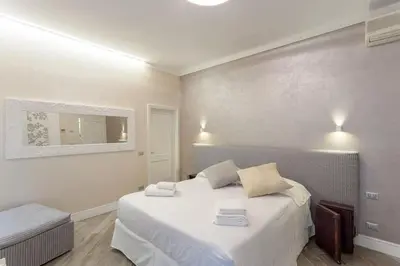 Letto o letti in una camera di DUOMO SUITE GHIRLANDAIO