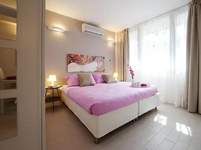 Letto o letti in una camera di La Farina Apartments