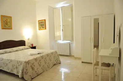 Letto o letti in una camera di Affittacamere Vanessa