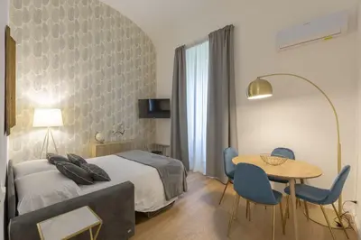 Letto o letti in una camera di FLORENCE FIORINO APARTMENT