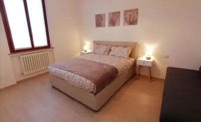 Letto o letti in una camera di San Bartolo Rent Apartments, due passi da Firenze