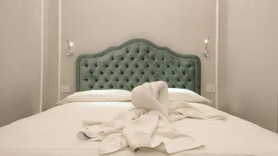 Letto o letti in una camera di Vivaldi luxury suites