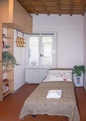 Letto o letti in una camera di Romantico Balcone in Centro