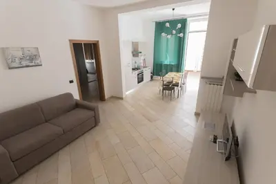 Area soggiorno di Amalia Apartment Via La Farina
