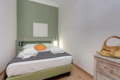 Letto o letti in una camera di Borgo Apartment by Mamo Florence