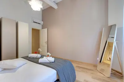 Letto o letti in una camera di Borgo Apartment by Mamo Florence